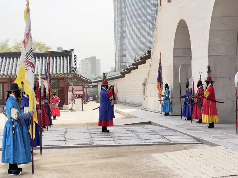 The reenactment of the ceremony that took place when the guards changed during the Joseon dynasty. I am still a little uncertain why these ceremonies are such a big thing.