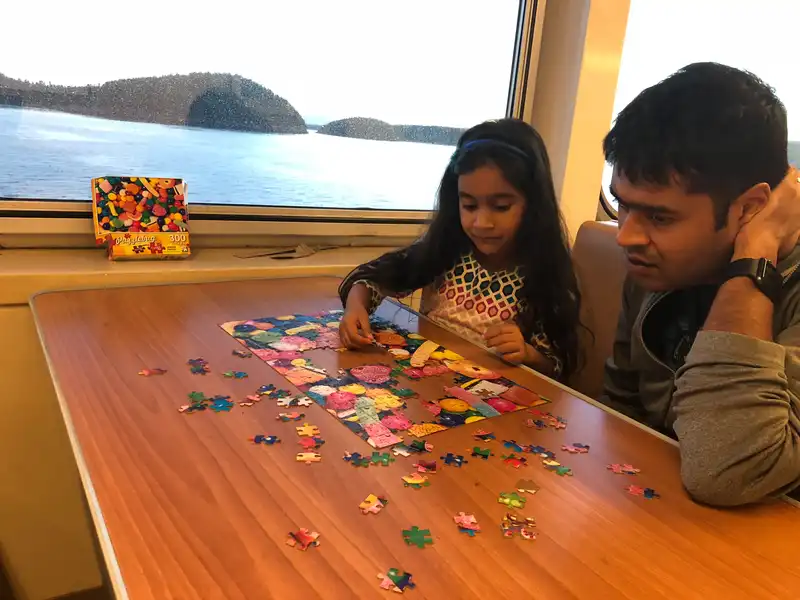 Mira's new favorite activity is doing a puzzle on the ferry.