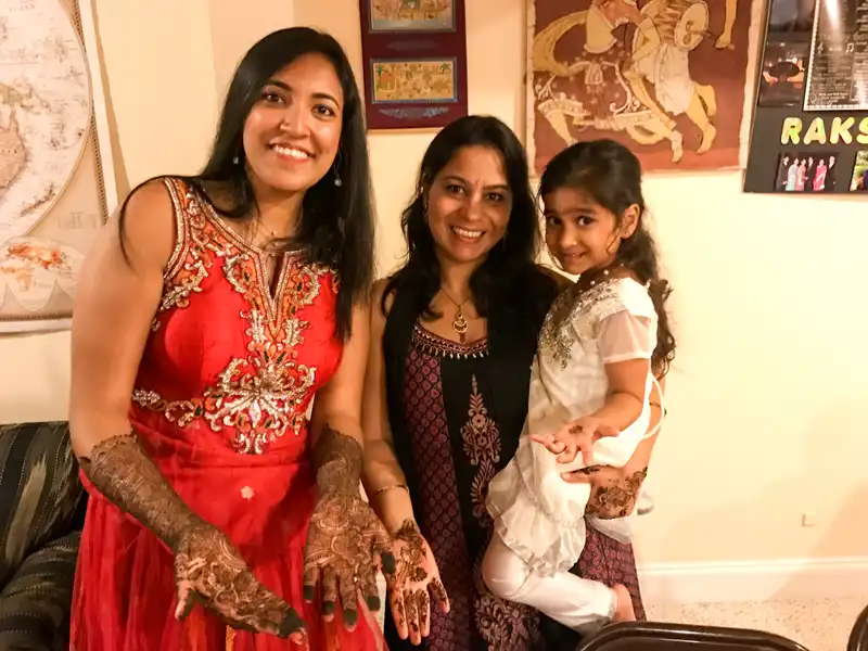 Mona, Sonali, and Mira showing of their Mehndi