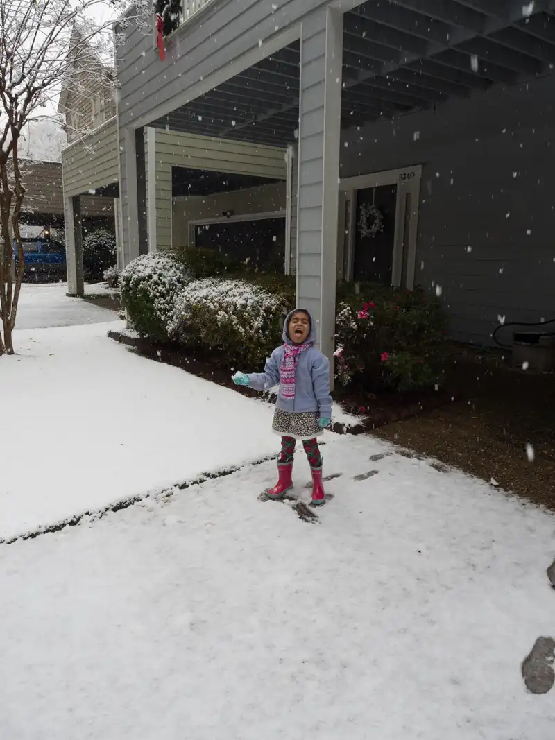 Mira catching snowflakes on her tongue