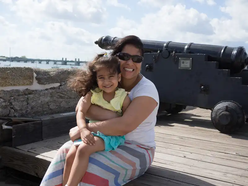 Sonali and Mira in front of a cannon overlooking Matanzas River